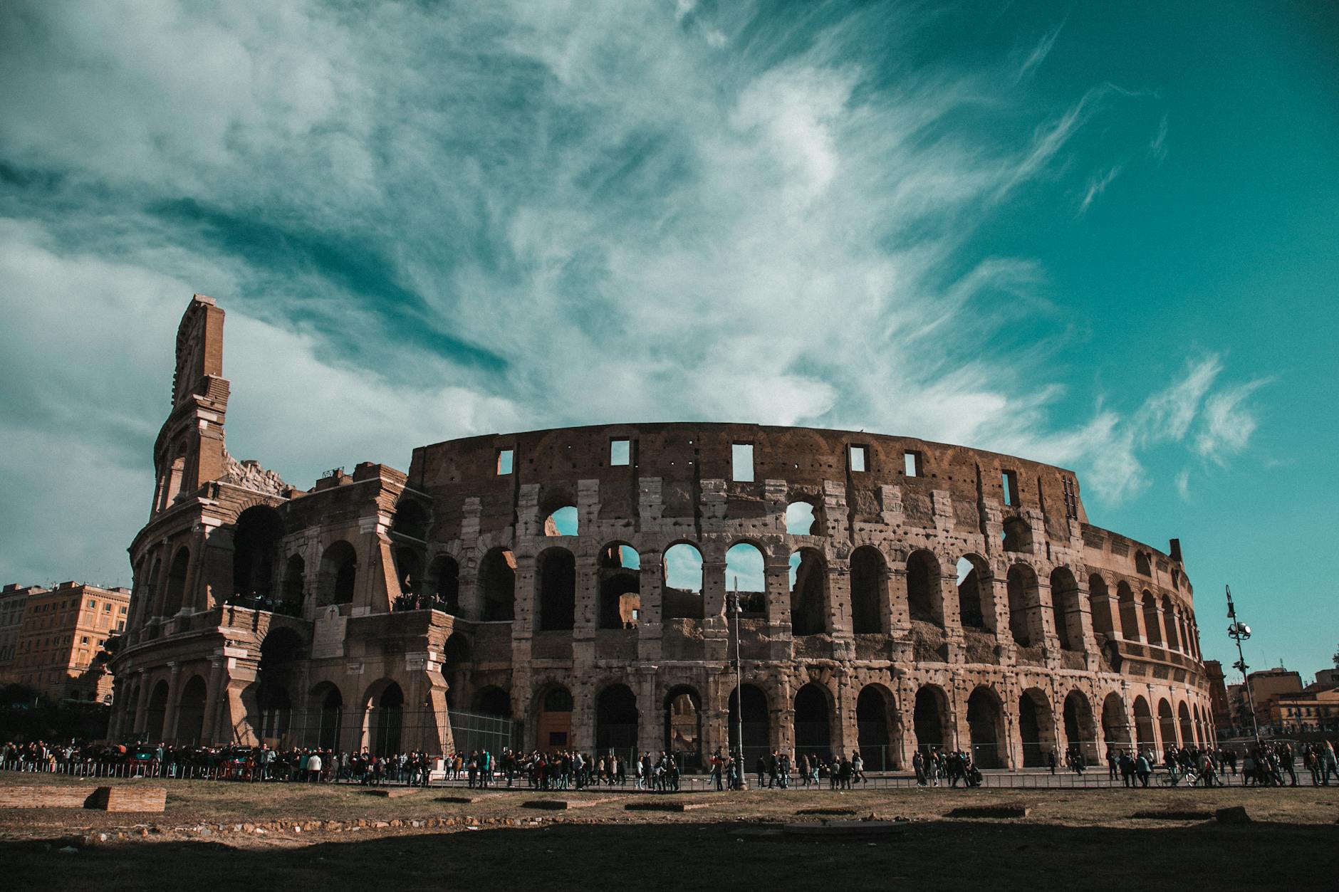 Aerial view of the Colosseum in Rome surrounded by historic cityscape