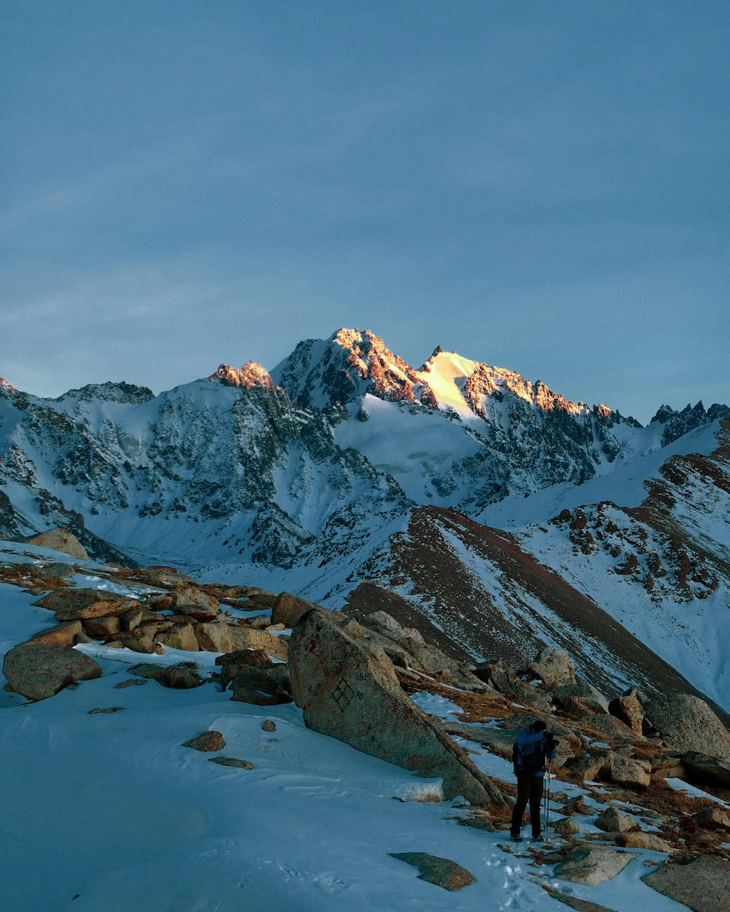 now-capped mountains overlooking Almaty cityscape, Kazakhstan”