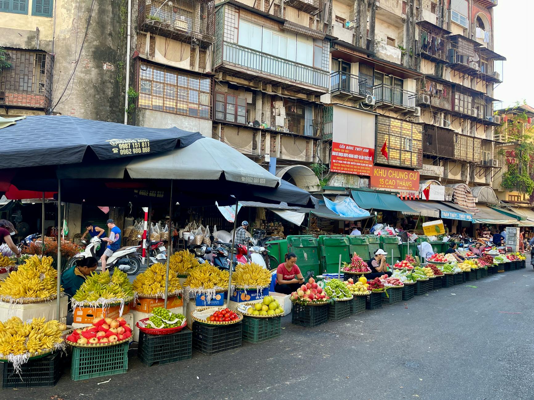 Bustling Vietnam street market with colorful stalls and fresh produce