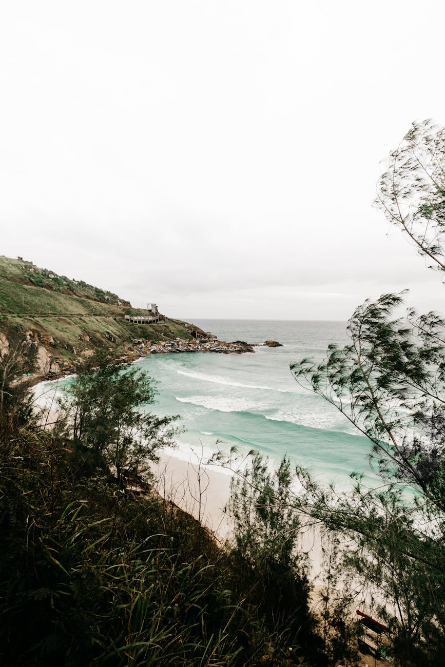 Prainha Beach in Rio de Janeiro with golden sand and lush green cliffs