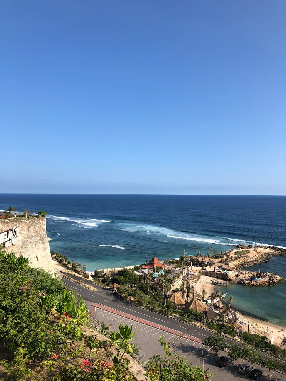 White sandy beaches of Nusa Dua with turquoise waters and clear skies
