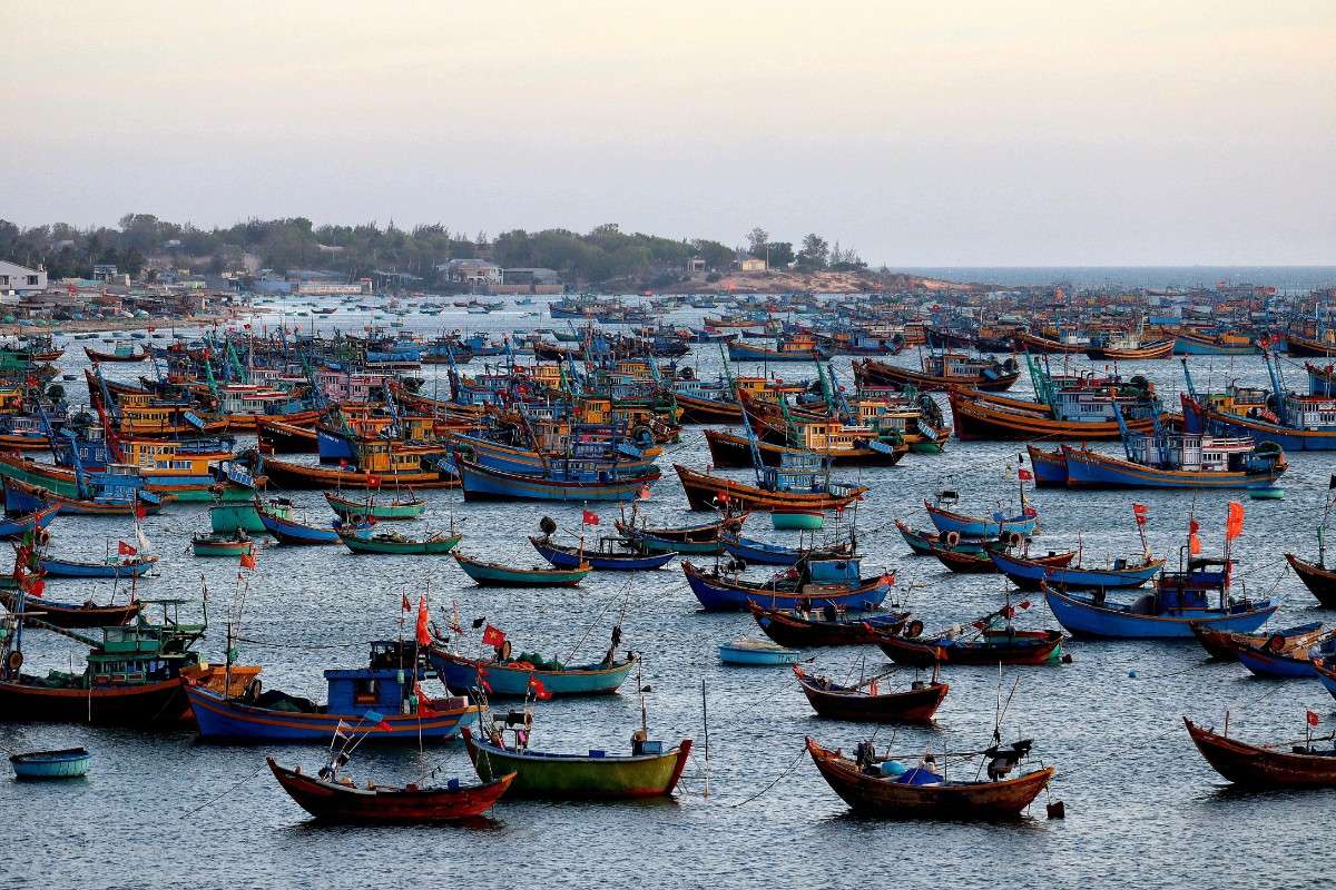 Colorful fishing boats at Mui Ne harbor in Vietnam during summer